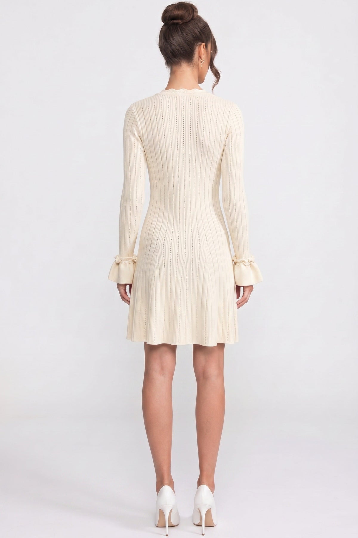 V-Neck Ribbed Knit Mini Dress with Ruffle Hem and Bow Cuffs – Ivory