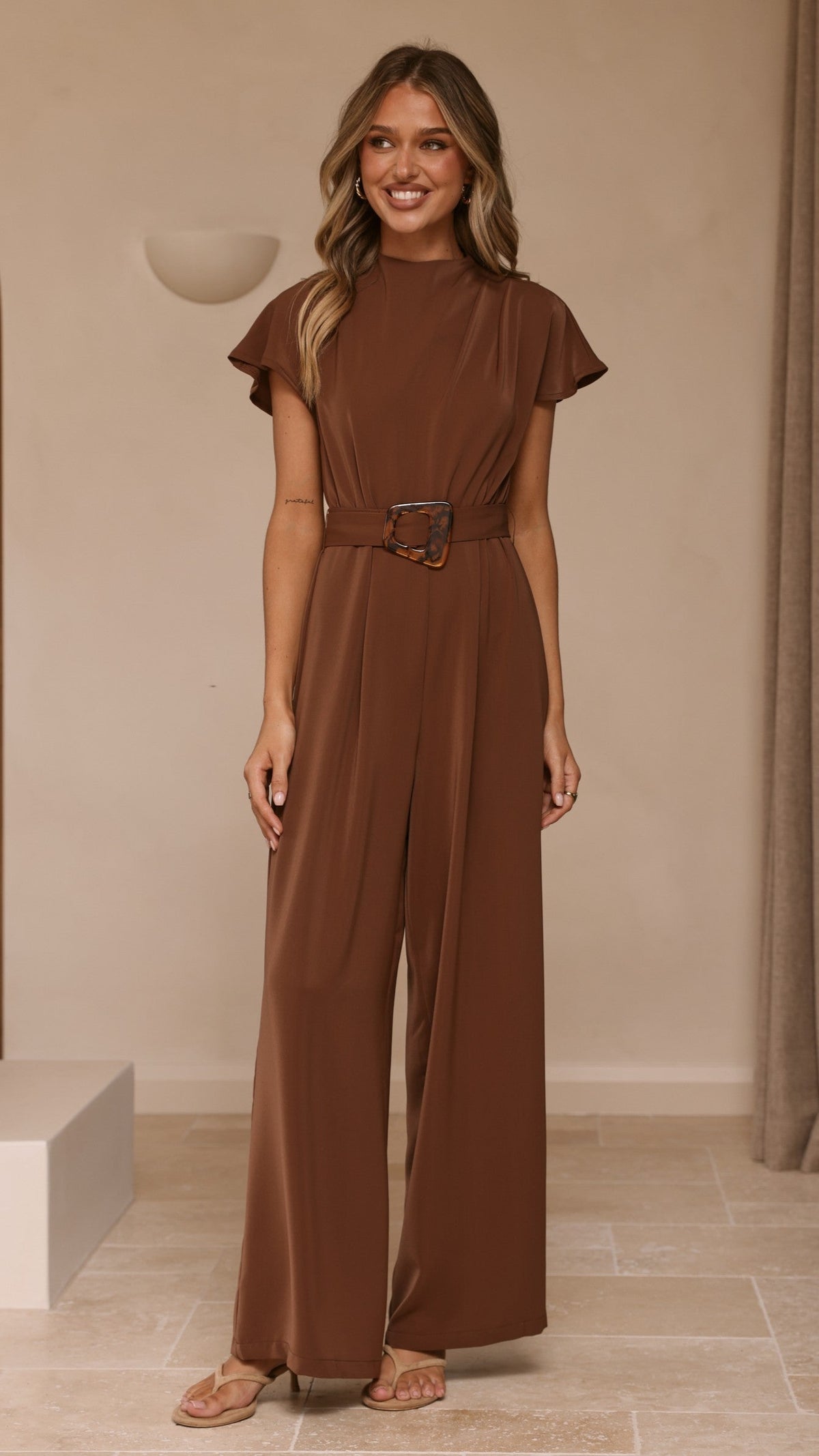 Demitra High Neck Cape Sleeve Jumpsuit with Tie Belt – Brown