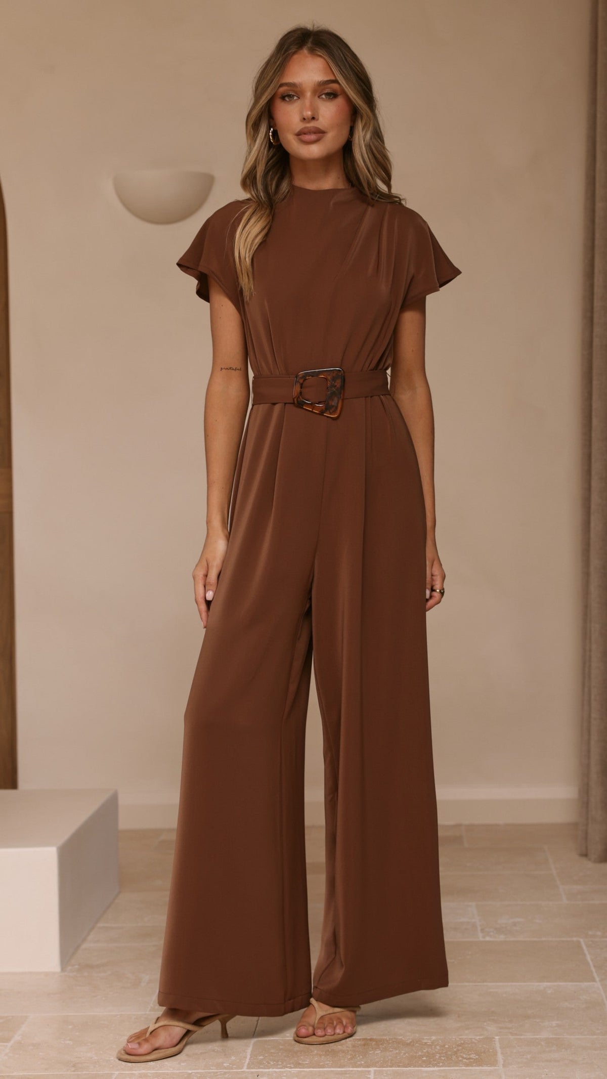 Demitra High Neck Cape Sleeve Jumpsuit with Tie Belt – Brown