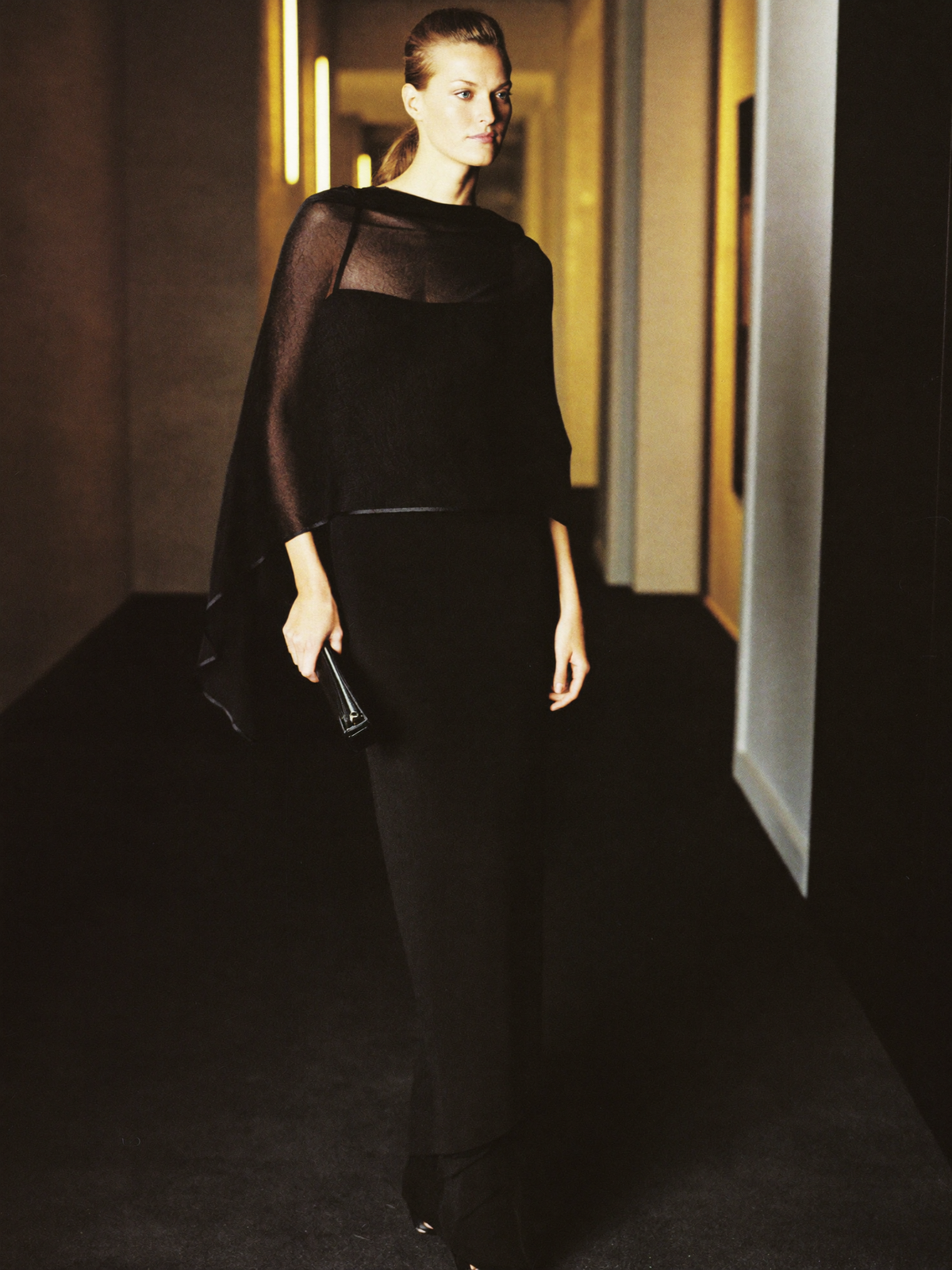 Black evening gown with clutch bag