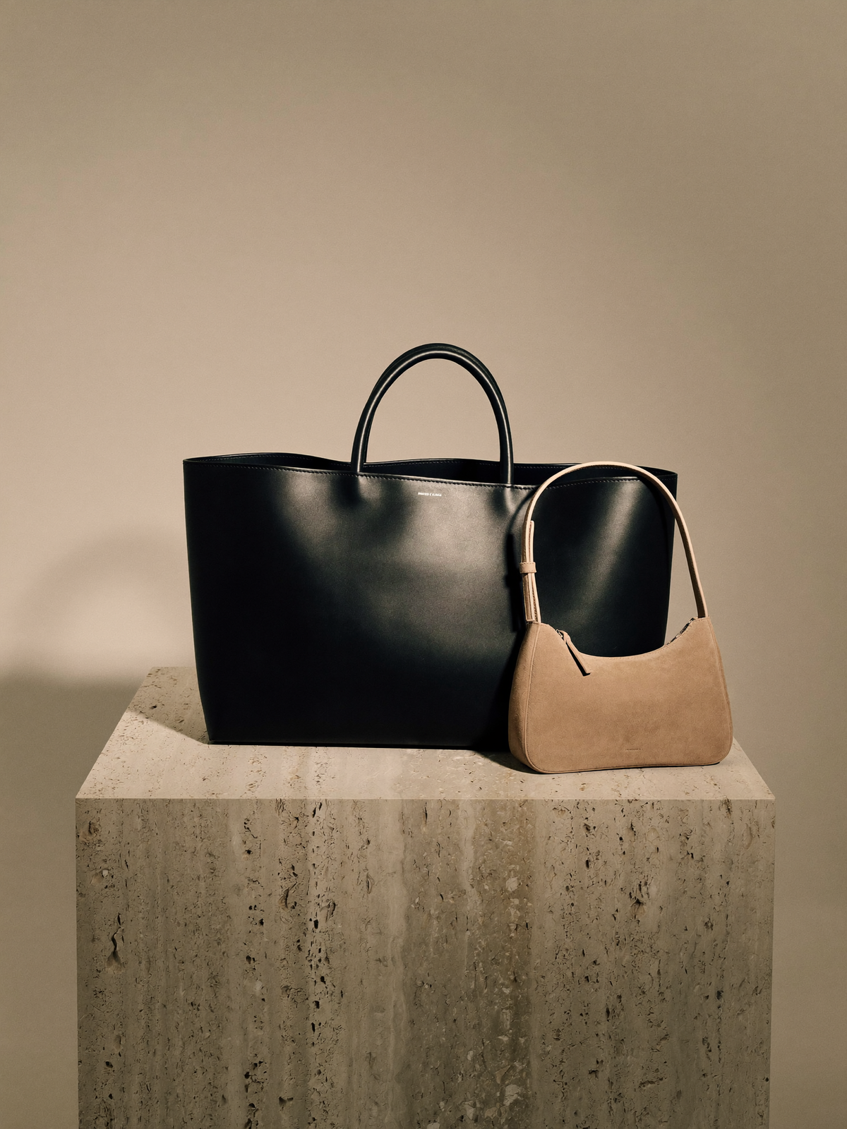 Black leather and stone suede handbags