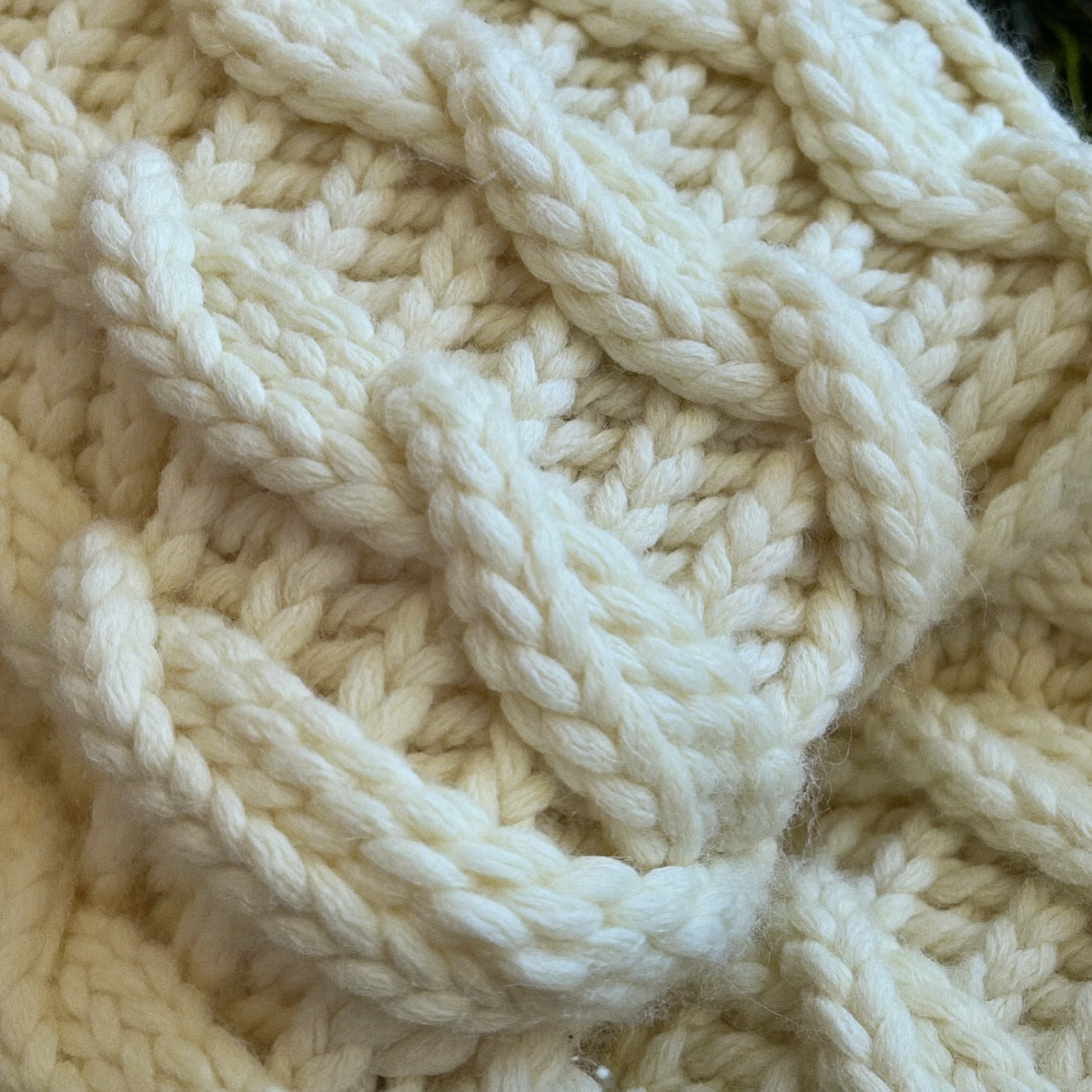 Ivory cable knit close-up