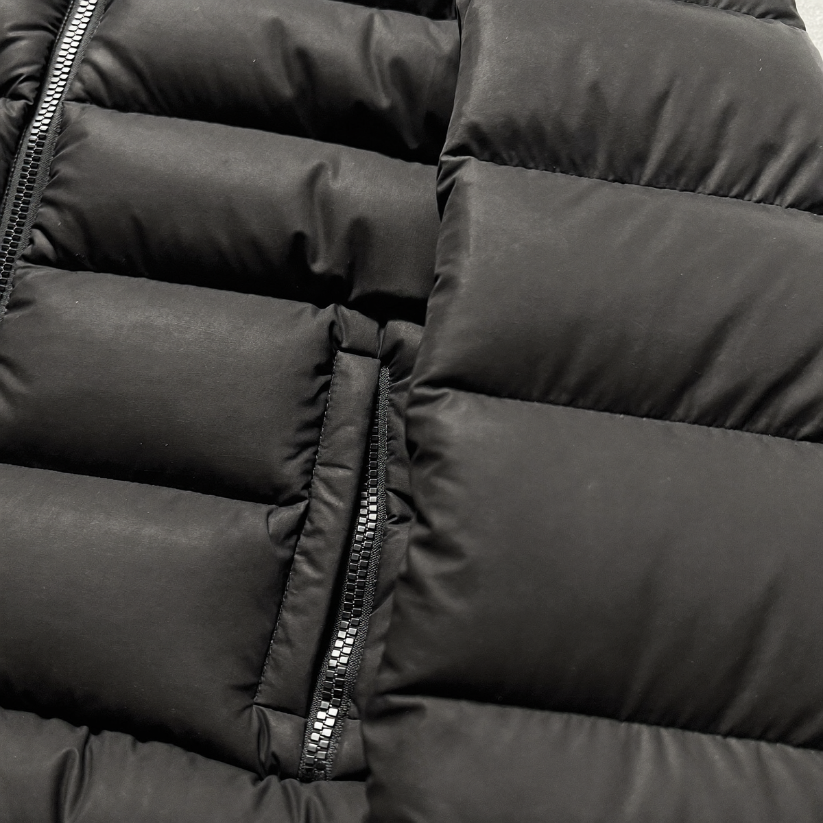 Black quilted puffer close-up