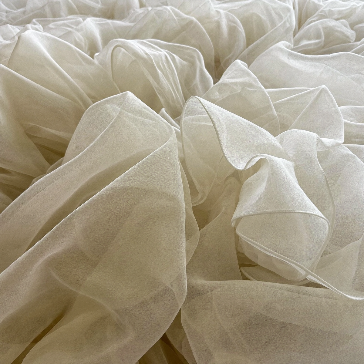 Sheer ivory chiffon close-up