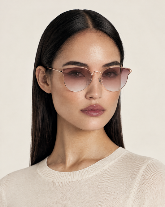 Marbella Rounded Geometric Sunglasses with Pink Gradient Lenses – Rose Gold worn by model