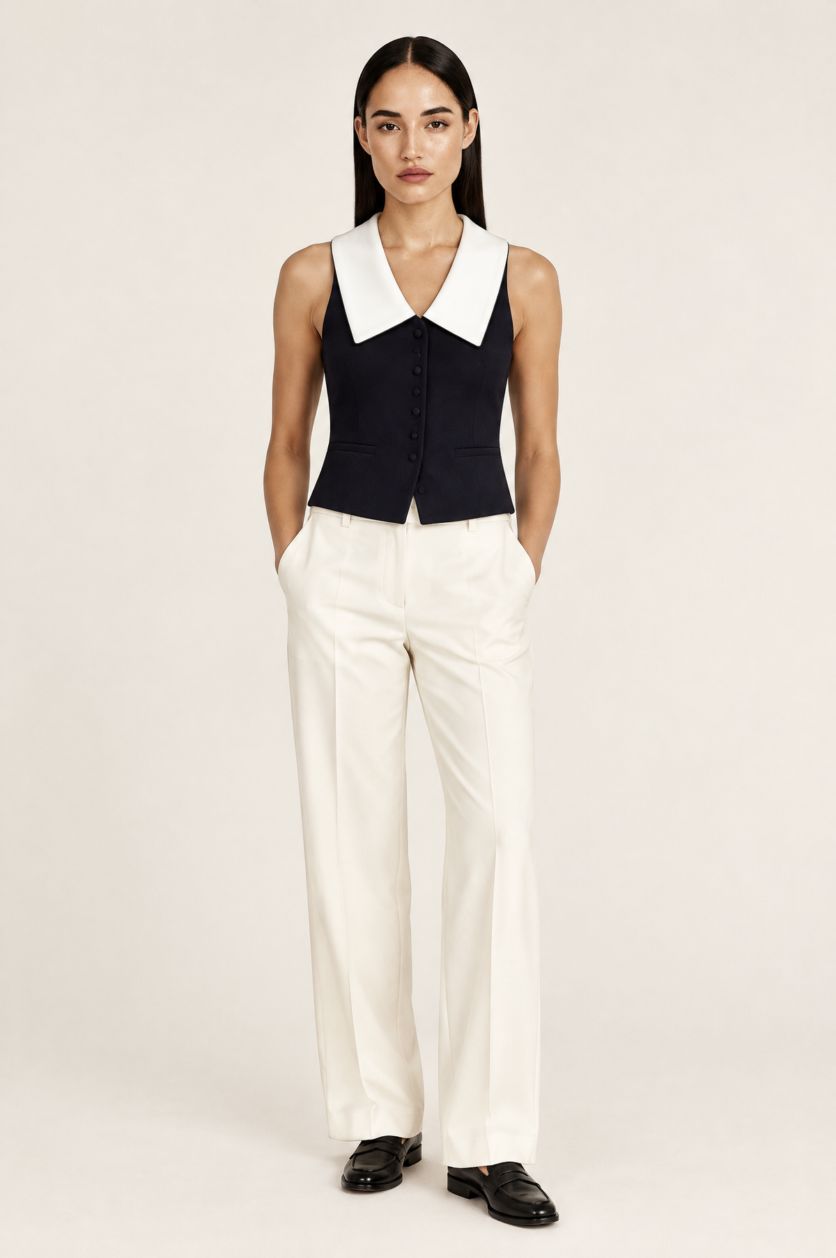 Milano Sleeveless Polo Collar Knit Vest with Button Placket – Black and White worn by model